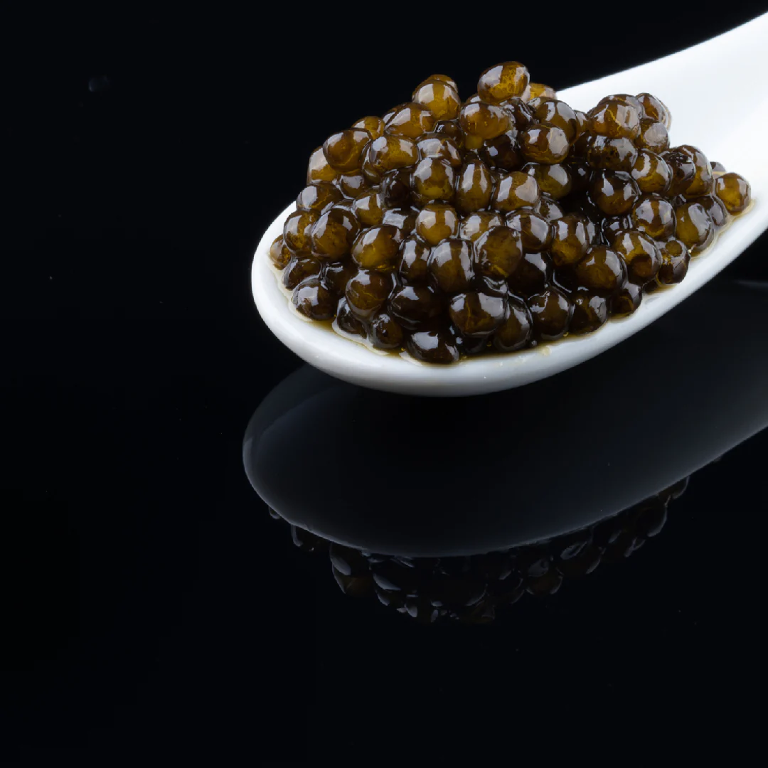 Title: "Beluga Caviar: A Culinary Odyssey into Opulent Pleasures" Introduction: Caviar, known as one of the most exquisite and delectable culinary delights worldwide, holds a special place in the realm of gourmet cuisine. Among the various types of caviar, Beluga caviar stands out as a distinguished and luxurious variety. This article explores the unique characteristics and gastronomic experience offered by Beluga caviar. History of Beluga Caviar: Beluga caviar has its roots in the Caspian Sea region, known for its rich history and cultural significance. Extracted from the eggs of Beluga sturgeon, this caviar variety has been a treasure in the culinary world, symbolizing opulence and tradition. Characteristics of Beluga Caviar: Large Egg Size: Beluga caviar is renowned for having some of the largest caviar eggs, providing a luxurious and indulgent experience to those who savor it. Creamy and Pleasant Flavor: The caviar's large eggs contribute to a creamy and delightful flavor, setting Beluga caviar apart from other varieties. Golden Color: Typically displaying a distinct golden hue, Beluga caviar adds an aesthetic appeal to its already exquisite visual and taste profile. Enjoyment in Consumption: Beluga caviar is often consumed directly, served on bread or blinis, offering a sophisticated and pleasurable experience. It is particularly well-suited for special ceremonies, celebrations, and formal occasions. Rich Nutritional Source: Beyond its culinary excellence, Beluga caviar is a rich source of nutrients, including proteins, omega-3 fatty acids, vitamins, and valuable minerals. Various Uses of Beluga Caviar: Direct Consumption: Beluga caviar is commonly enjoyed directly, allowing connoisseurs to savor its unique flavor and texture. Gastronomic Decoration: The caviar is frequently used as a decorative element, enhancing the visual appeal of various dishes and sushi creations. Gourmet Culinary Applications: Renowned chefs often incorporate Beluga caviar as a key element in gourmet cuisine, elevating the sophistication of dishes. Conclusion: Beluga caviar, with its distinctive combination of flavor, size, and appearance, has secured its place as one of the most luxurious and sought-after culinary experiences globally. It represents not only a culinary delight but also a cultural and historical legacy from the Caspian Sea region. Whether enjoyed directly or used to enhance gourmet creations, Beluga caviar continues to captivate the palates of culinary enthusiasts, embodying the epitome of fine dining indulgence.